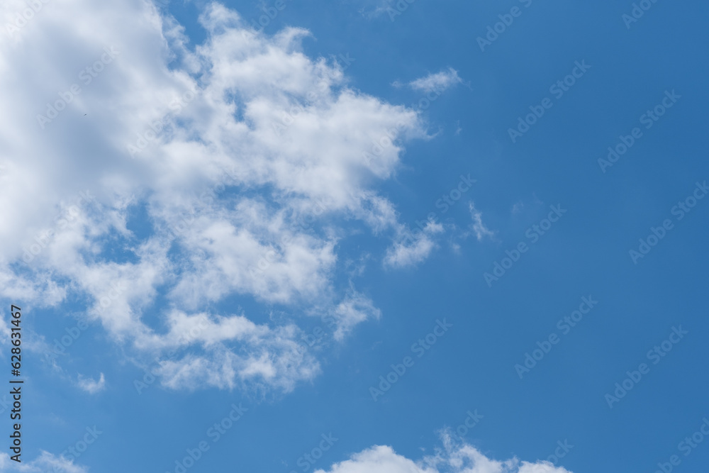 Clear blue sky and white clouds. White fluffy clouds in the blue sky. Beautiful white cloud on clear blue sky as nature concept .