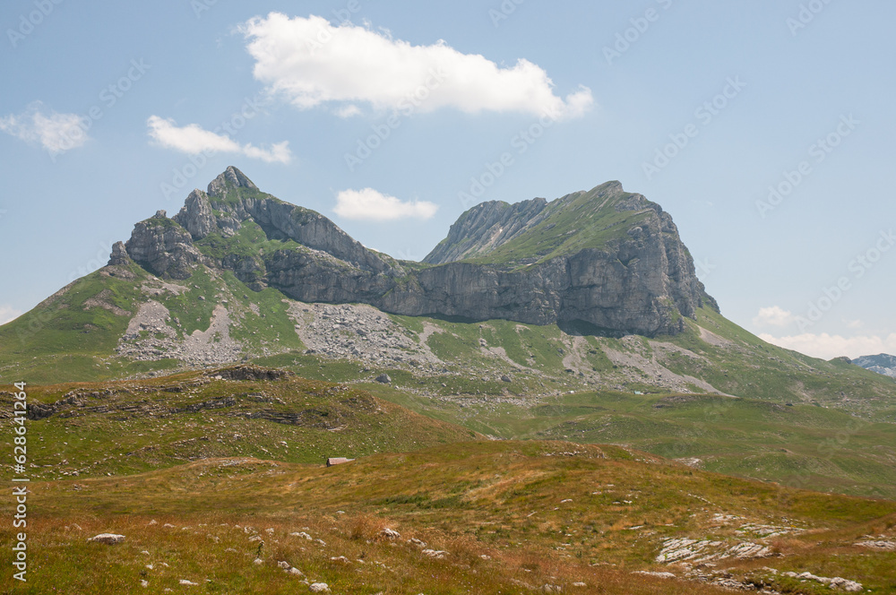 The Durmitor National Park is in located a wide mountain region. Mountain peak saddle. 