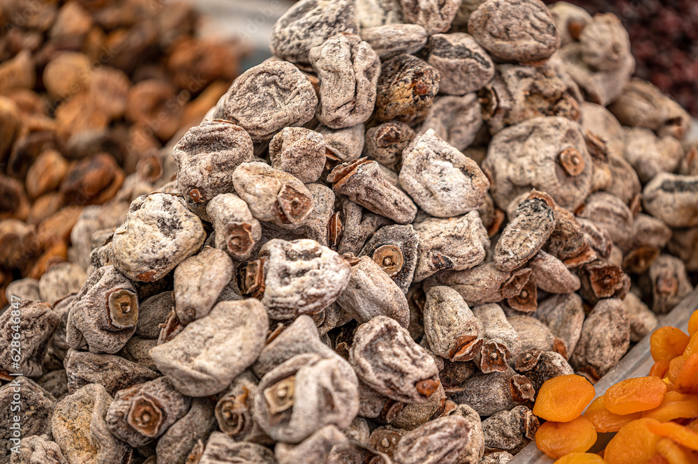 Dried persimmon fruits in the street market. sweet appetizing healthy dried persimmon Dried persimmon fruits in the street market. sweet appetizing healthy dried persimmon