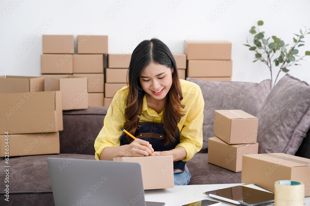 Online business owner preparing parcel for customer shipment. Online business owner preparing parcel for customer shipment.
