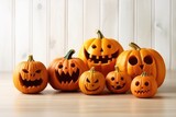 halloween pumpkins in humorous style on wooden floor isolated on white background