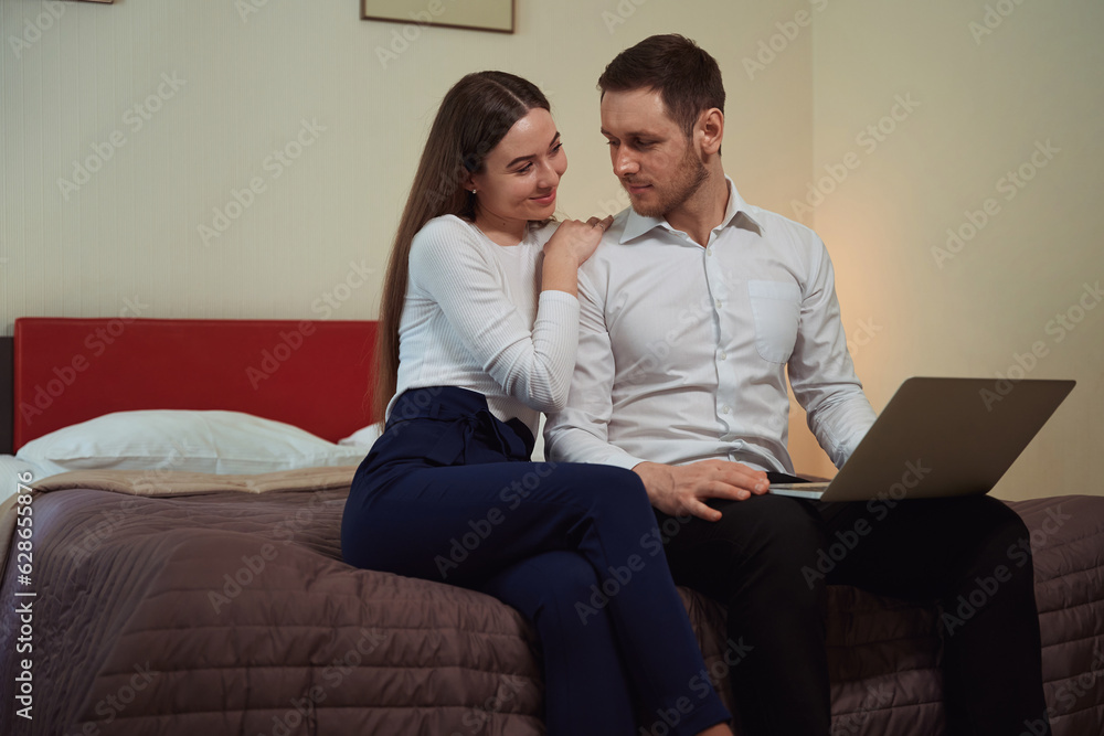 Young couple relaxing in the hotel room Young couple relaxing in the hotel room