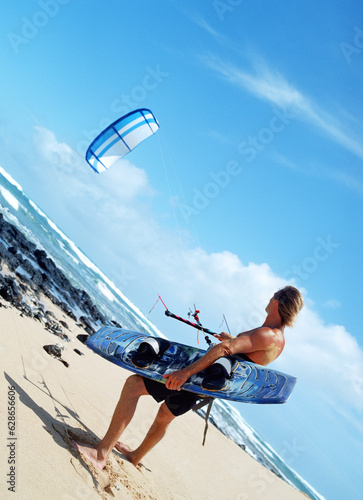 man kite surfing at the beach
