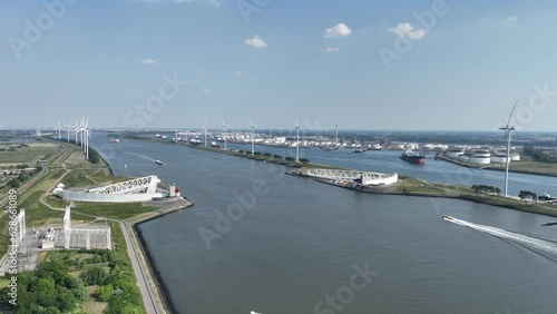 Aerial drone video of The Maeslantkering storm surge barrier coastal flood defence system that was commissioned in 1997 on the border of Het Scheur and the Nieuwe Waterweg near Hoek van Holland photo