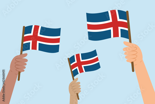 Diverse people hands raising and waving flags of Iceland. Vector illustration of Icelandic flags in flat style on blue background.