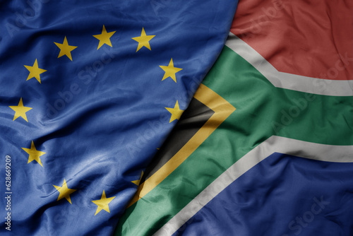 big waving realistic national colorful flag of european union and national flag of south africa .