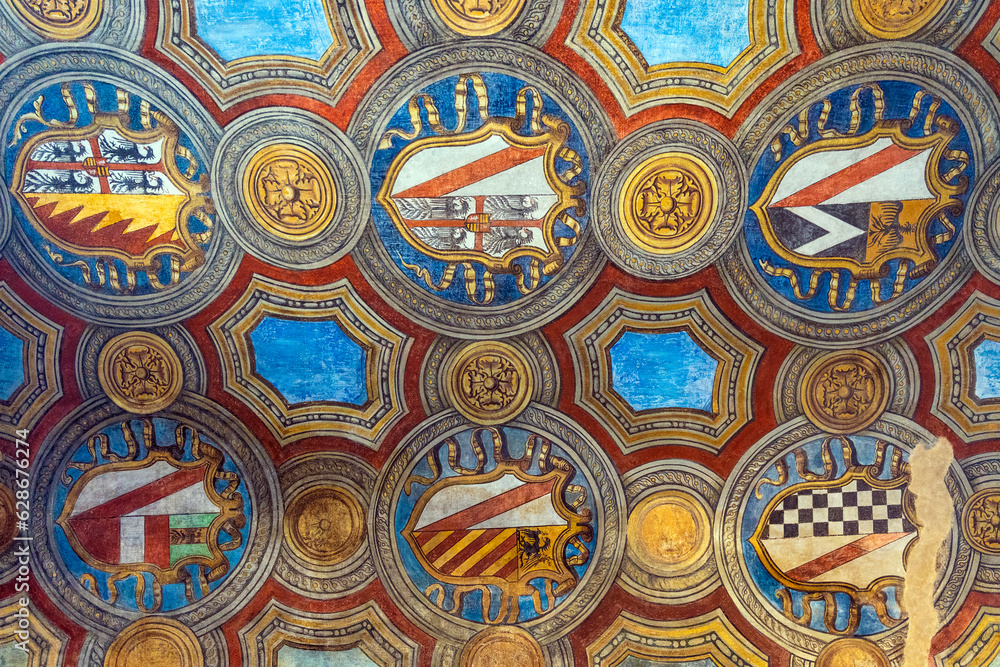 Detail of a fresco with coat of arms at the entrance of Medieval castle 
