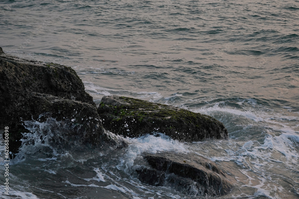 waves crashing on rocks