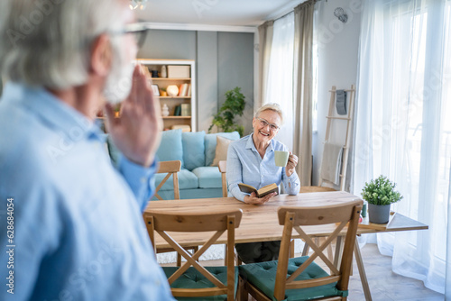 senior couple man and woman husband and wife at home talk