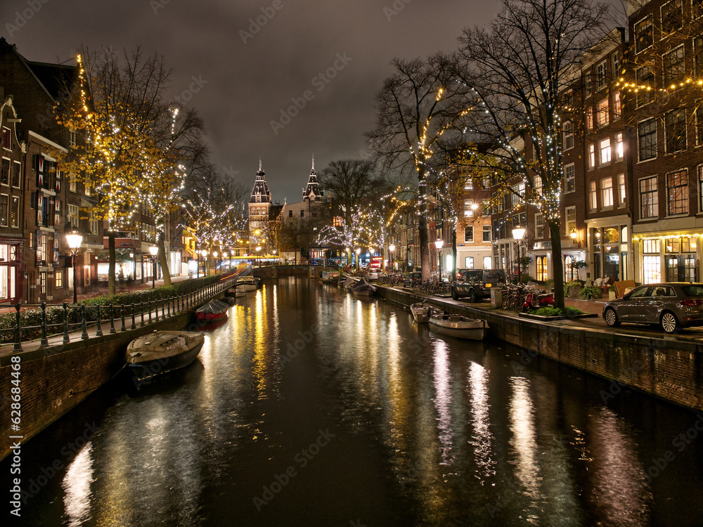Amsterdam architecture and canal views in city lights during Christmas. Amsterdam, Netherlands
