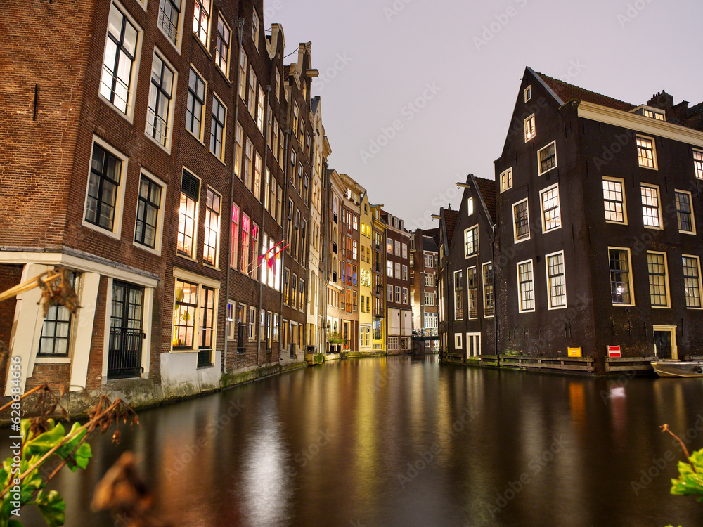 Amsterdam architecture and canal views in city lights during Christmas. Netherlands