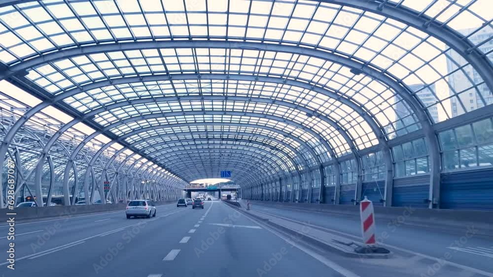 Expressway. Glass tunnel on the highway. Glazed acoustic half tunnels