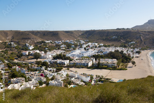 Beach and village of Agua Amarga, Cabo de Gata in the province of Almeria, Andalusia, Spain. photo