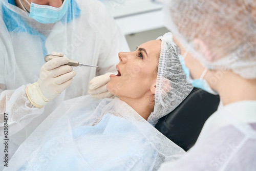 Young female patient at a doctors appointment in dental chair