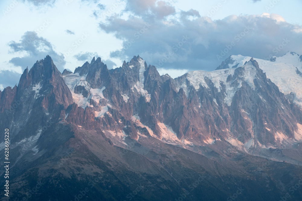 Aiguille du Midi, Aiguille du Plan, and Aiguille du Grépon in the Mont Blanc massif at nightfall Aiguille du Midi, Aiguille du Plan, and Aiguille du Grépon in the Mont Blanc massif at nightfall