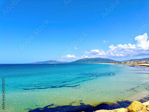 Fototapeta Naklejka Na Ścianę i Meble -  wonderful blue turquoise Atlantic Ocean at the beach of Tarifa in summer, Playa de los Lances, Playa Santa Catalina, Costa de la Luz, Andalusia, province of Cádiz, Spain