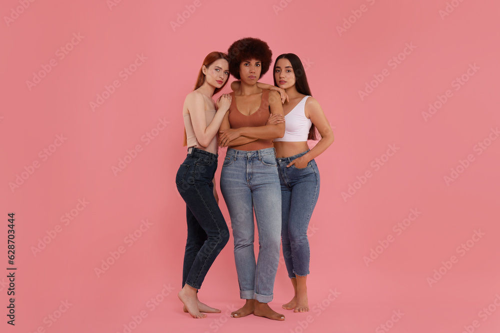 Portrait of beautiful young women on pink background Portrait of beautiful young women on pink background