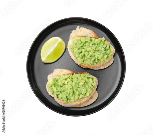 Delicious sandwiches with guacamole and lime wedge on white background, top view