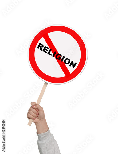 Atheism concept. Woman holding prohibition sign with crossed out word Religion on white background photo