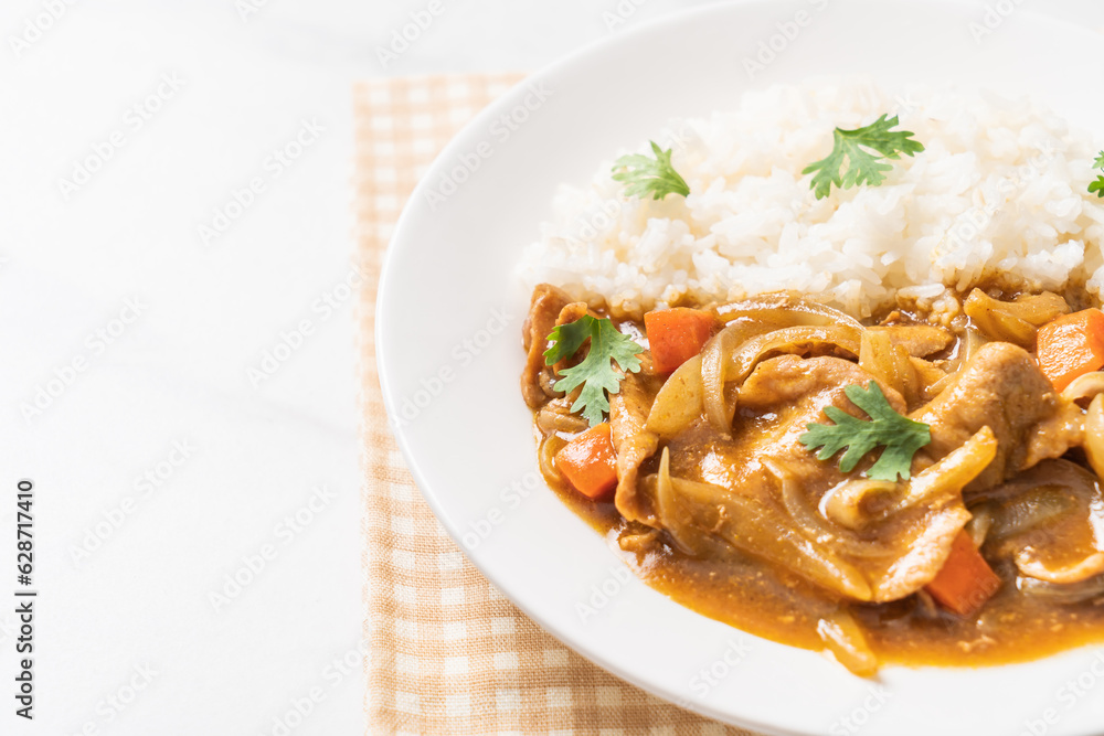 Japanese curry rice with sliced pork, carrot and onions Japanese curry rice with sliced pork, carrot and onions