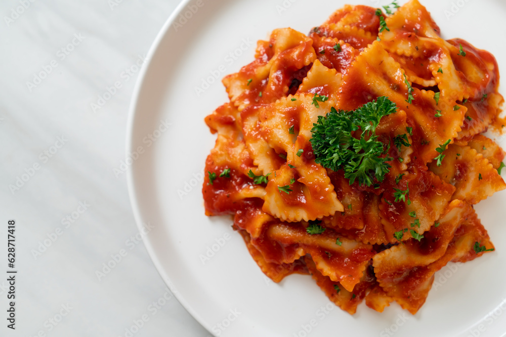 farfalle pasta in tomato sauce with parsley farfalle pasta in tomato sauce with parsley