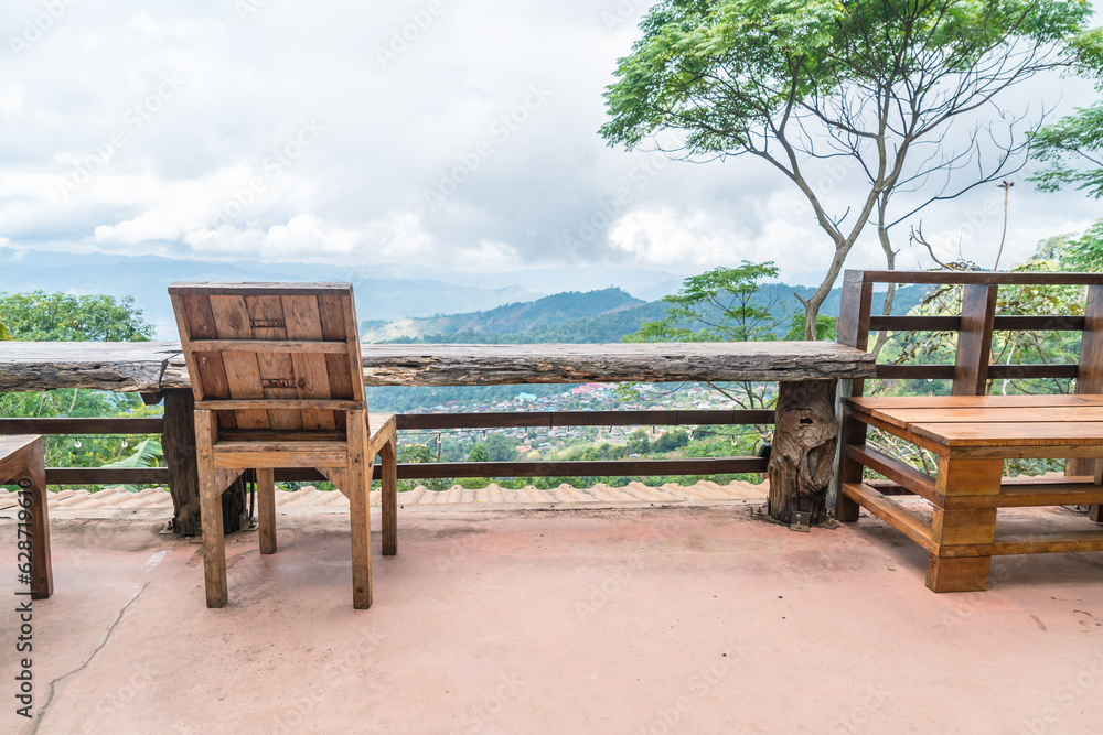 wood bar and chair with mountain hill background wood bar and chair with mountain hill background