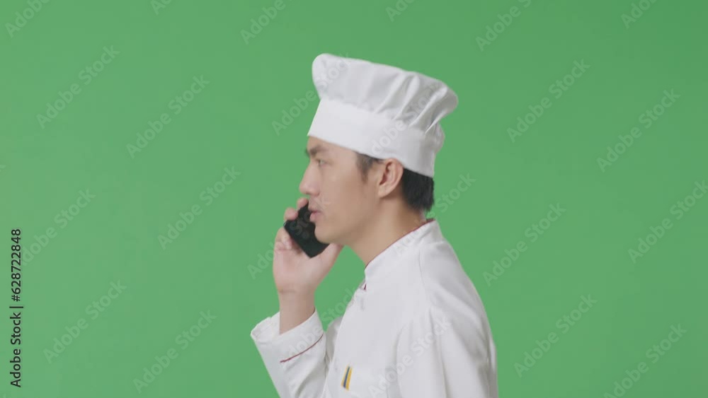 Side View Of Asian Man Chef Talking On Smartphone While Walking In The Green Screen Background Studio
Side View Of Asian Man Chef Talking On Smartphone While Walking In The Green Screen Background Studio