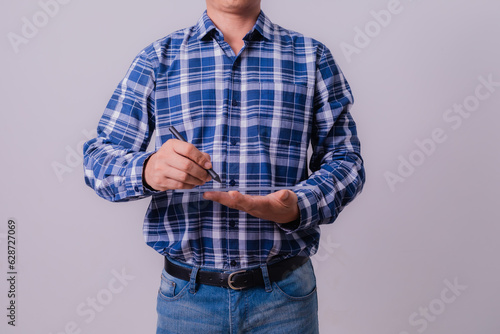 Asian engineer in striped shirt on white background