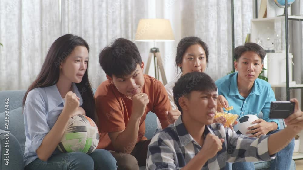 Asian Teenagers Cheering And Watching Football Game On Smart Phone At Home
Asian Teenagers Cheering And Watching Football Game On Smart Phone At Home