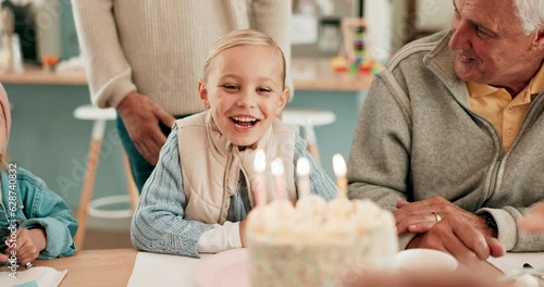 Birthday party, surprise cake and child with family to celebrate together with dessert in happy home. Party, cover eyes and social gathering with people, grandparents and kids for fun, wish or candle photo