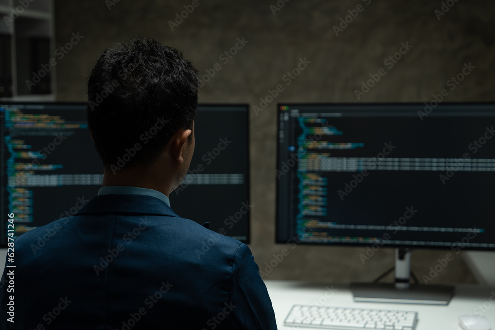 IT programmer working on desktop computer Male expert innovating software engineer app development program check coding in bugging system. IT programmer working on desktop computer Male expert innovating software engineer app development program check coding in bugging system.