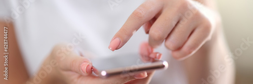 Close-up of smartphone in hands of woman.