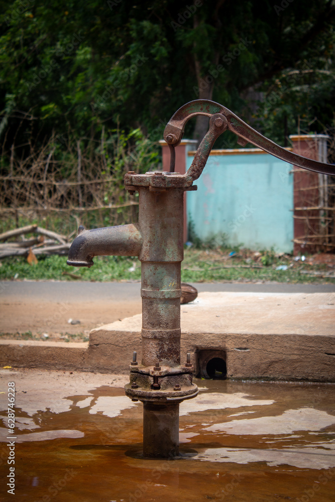 Old fashioned hand pump used for pumping water found in village area