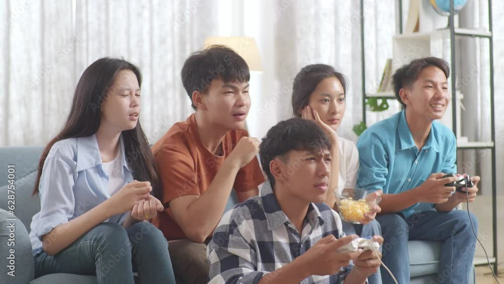 Asian Teenagers Friends Playing Video Games At Home And Disappointed
Asian Teenagers Friends Playing Video Games At Home And Disappointed