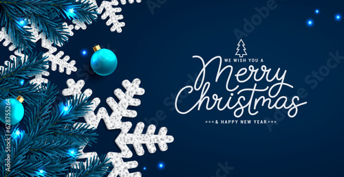 Merry christmas text vector design. Christmas greeting card with snow flakes and pine tree spruce elements in blue elegant background. Vector illustration holiday season xmas card.
