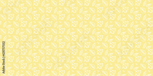 Autumn pattern on a soft yellow background with white painted outlines of autumn leaves