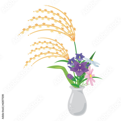 花瓶に入ったススキと秋の花々