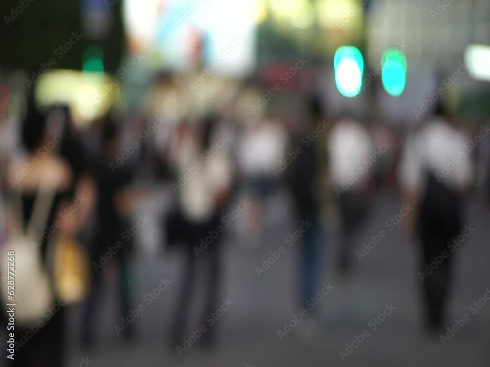 Japan famous Shinuya junction cross in evening sky and neon light busy crowd street pov motion Japan famous Shinuya junction cross in evening sky and neon light busy crowd street pov motion