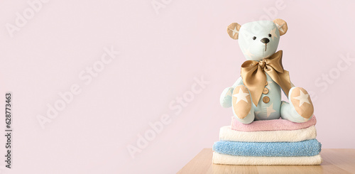 Bear toy with baby clothes ...
