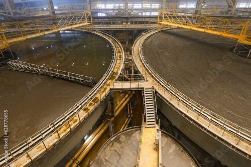Foto Large round floatation machine tank full of liquid at plant