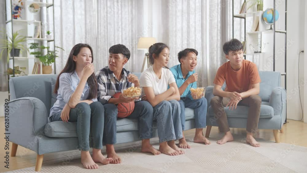Asian Teenagers Cheering, Eating And Watching Basketball Game On Tv At Home
Asian Teenagers Cheering, Eating And Watching Basketball Game On Tv At Home