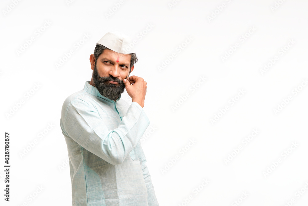 Indian man twirling his mustache and giving expression Indian man twirling his mustache and giving expression