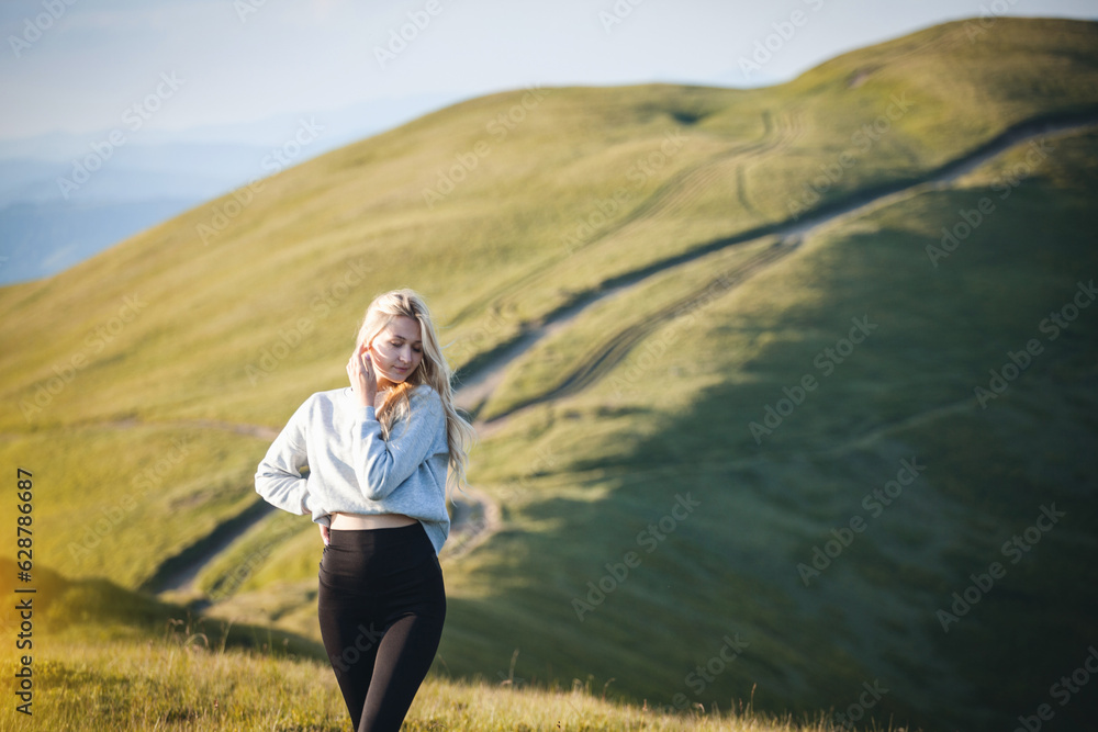 Young Fit Model Girl in High Mountains Young Fit Model Girl in High Mountains