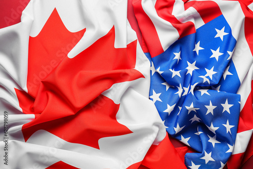 Flags of Canada and USA on red background