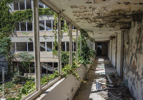Corridor in ruined hotel in so called Bay of Abandoned Hotels in Kupari, Croatia photo