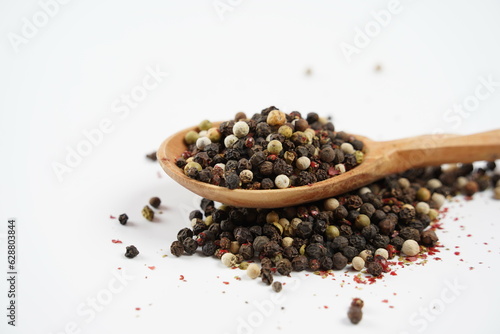 Four Pepper Blend, Colorful peppercorn mix on wooden spoon