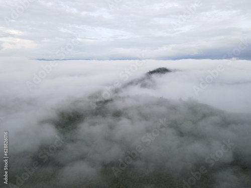 white fog, mountains, and beautiful orange sky scenery