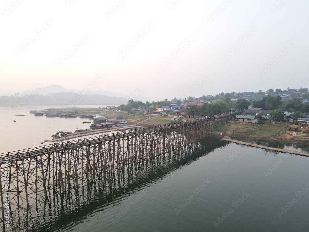 Mon Bridge, the longest wooden bridge in Thailand at Kanchanaburi Province  with the morning sun