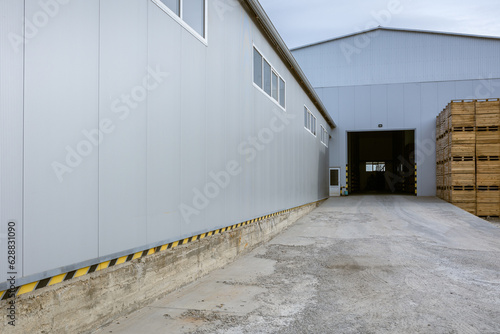 Cargo terminal of the logistics center. Stacked up empty pallets boxes. Ramp for loading. Supply chain management of finished products in industrial production