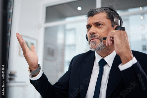Call center, mature man and confused in office with problem, mistake or crm fail. Serious, telemarketing or frustrated consultant with sales error, glitch crisis or 404 for customer service challenge